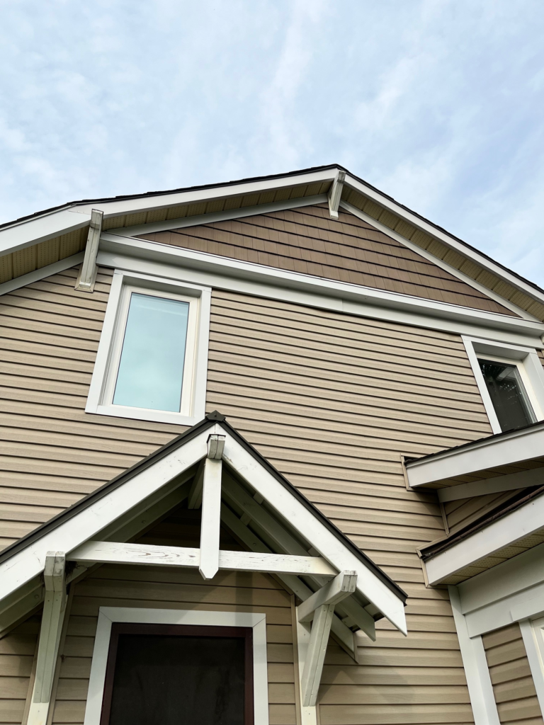 Beige siding project in Ottawa showcasing soffit fascia and exterior finish