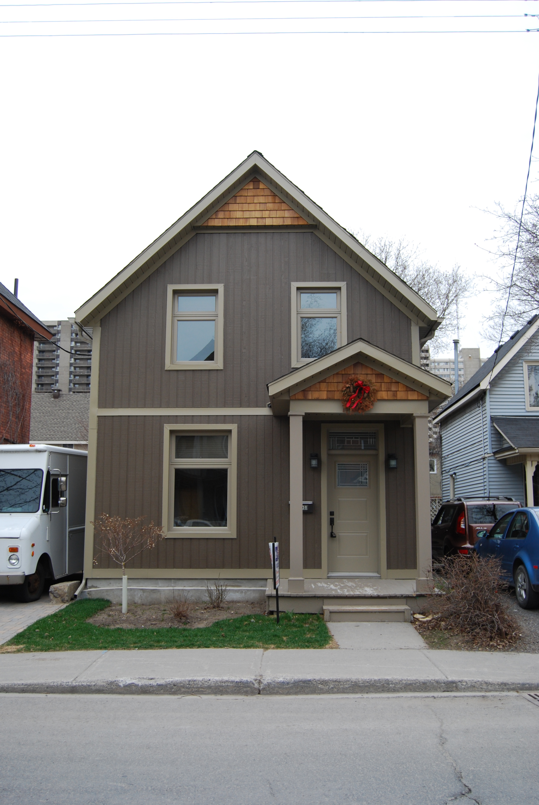 Ottawa siding project with grey vertical siding and white trim