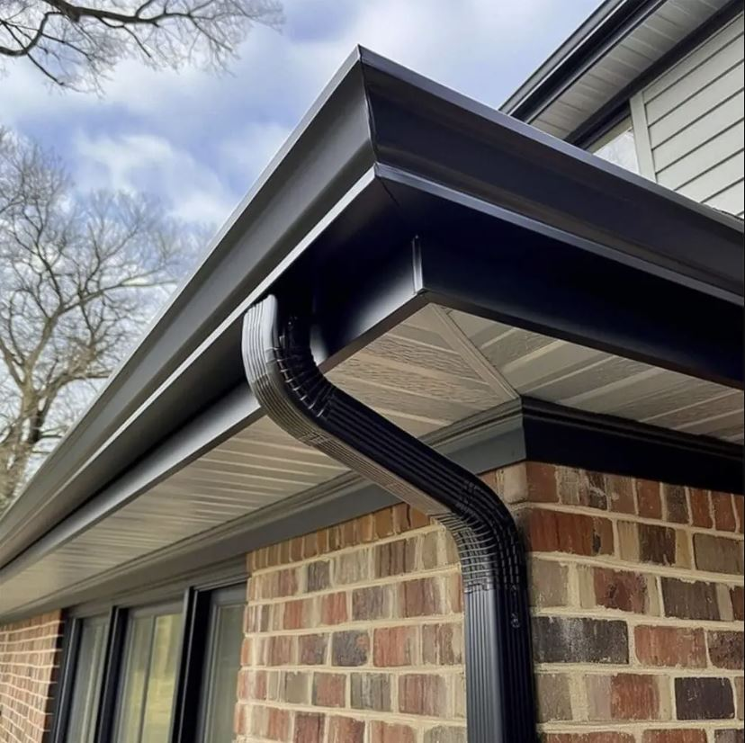 Eavestrough services Ottawa with black gutter system on brick home