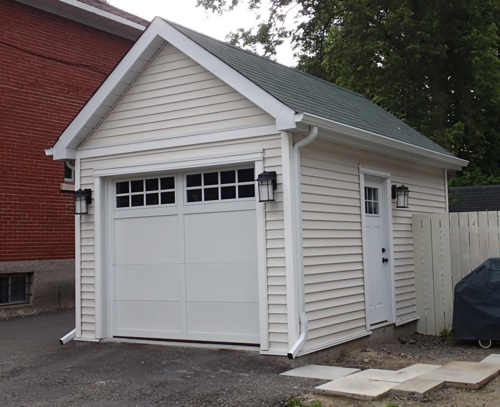 White siding garage project in Ottawa with new soffit fascia and trim